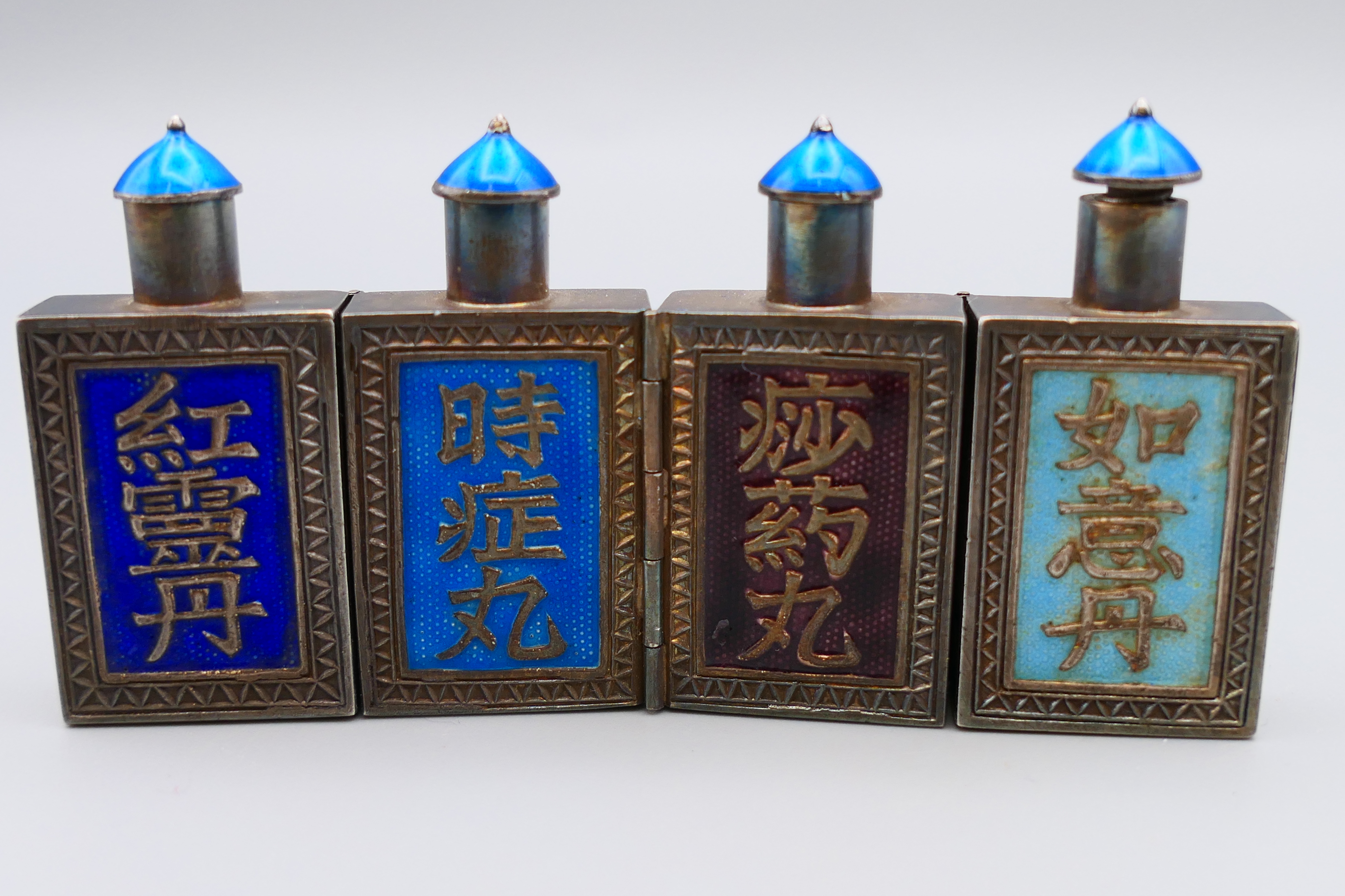 A set of four Chinese silver and enamel folding hinged snuff bottles. 4 cm high, 8 cm long opened. - Image 2 of 9