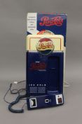 A boxed vintage Pepsi Cola novelty telephone.