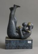 An abstract bronze model of a mother and child. 31 cm high.