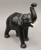 A leather model of an elephant. 34 cm high.