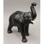 A leather model of an elephant. 34 cm high.