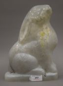 A vintage glass lamp shade in the form of a seated rabbit. 26 cm high.