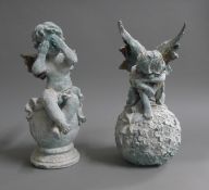 An iron model of a cherub and an iron model of a fairy. The latter 30.5 cm high.