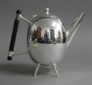 A Christopher Dresser style teapot. 16.5 cm high.