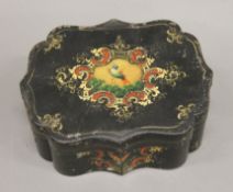 A 19th century toleware box. 16 cm wide.