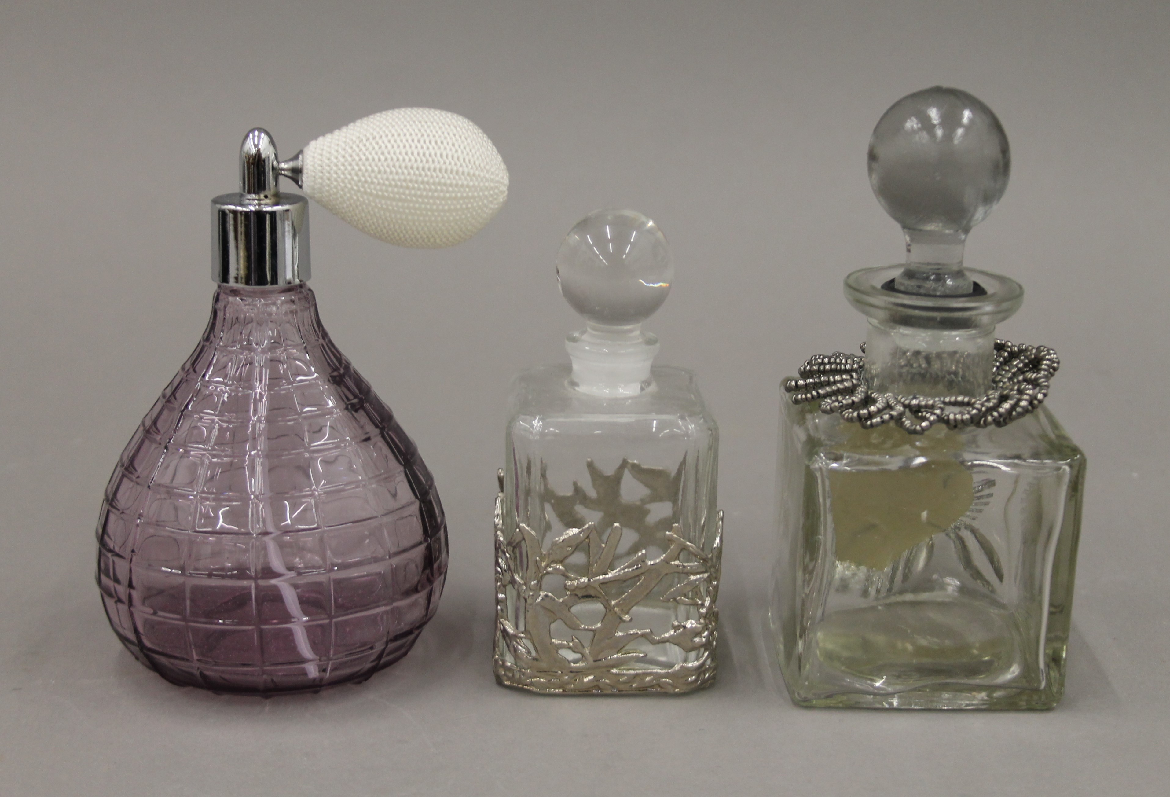 Three glass scent bottles.