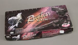 A boxed Air Type revolver.