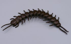 A bronze articulated model of a centipede. 15.5 cm long.