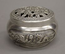 A Chinese silvered bronze circular box and cover decorated with a dragon and a phoenix,