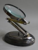 A large magnifying glass on stand.