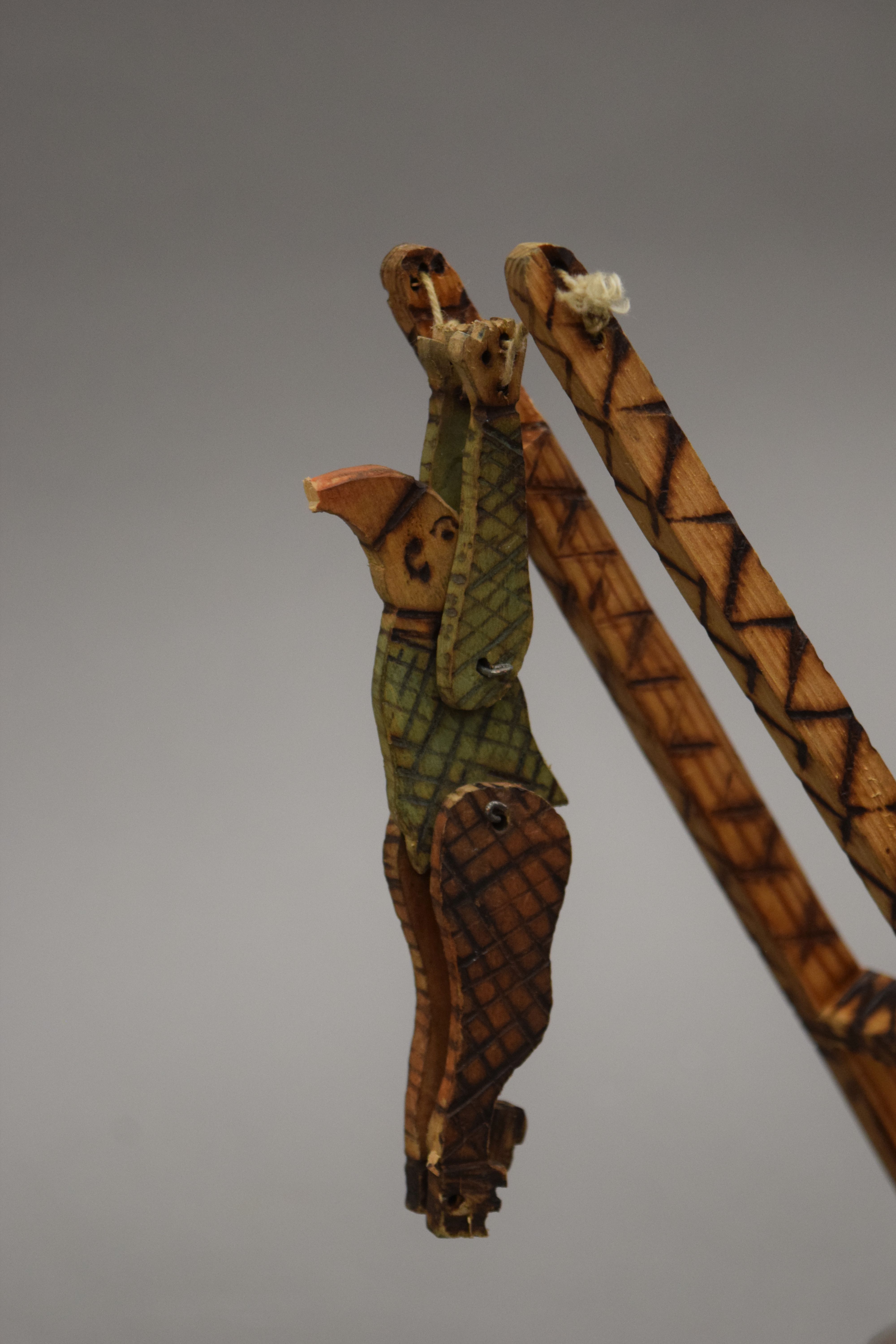 A vintage carved wooden and poker work acrobatic clown toy. 27.5 cm high. - Image 4 of 4