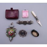 A quantity of Victorian brooches, a purse, a micro-mosaic pendant, a miniature silver trowel, etc.