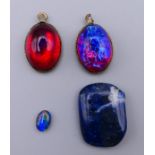 Four various gem stones including opals. Largest 1.75 x 1.25 cm.