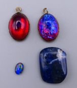 Four various gem stones including opals. Largest 1.75 x 1.25 cm.