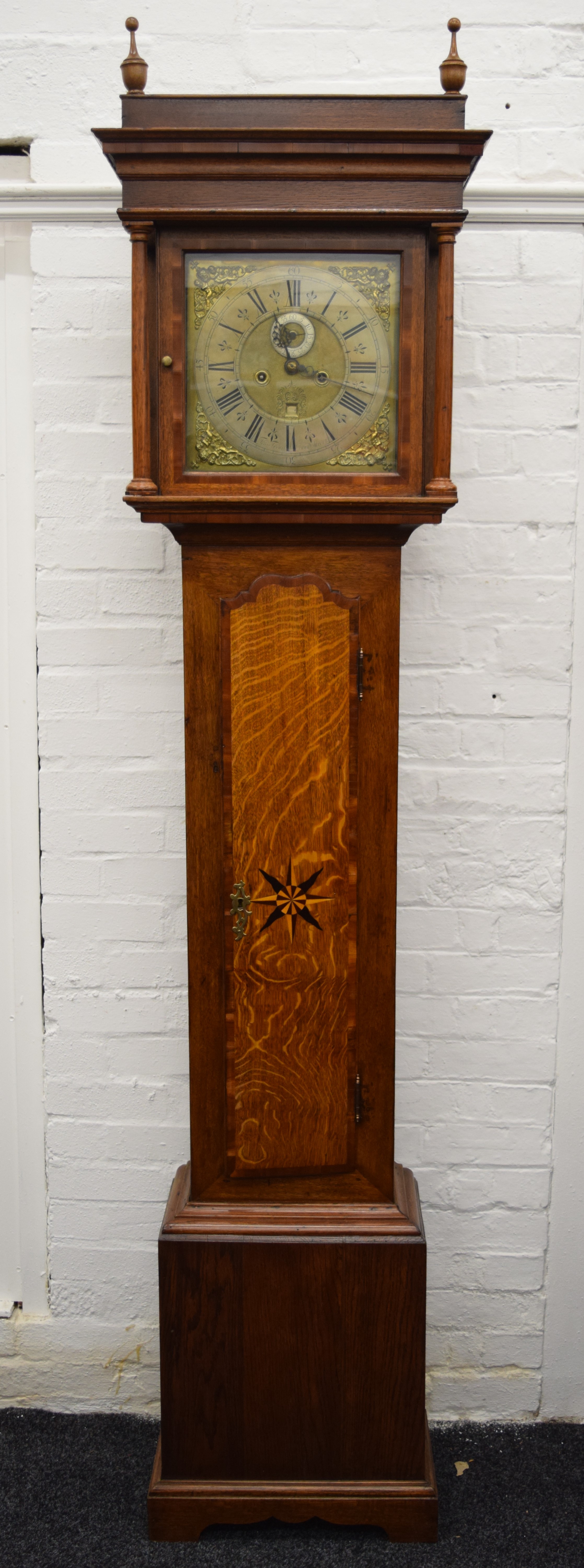 A late 18th/early 19th century oak eight-day longcase clock,