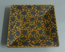 An Oriental lacquered square dish. 22 cm wide.