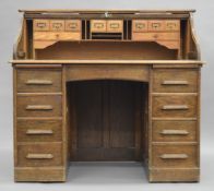 An early 20th century oak tambour front desk. 121 cm wide.