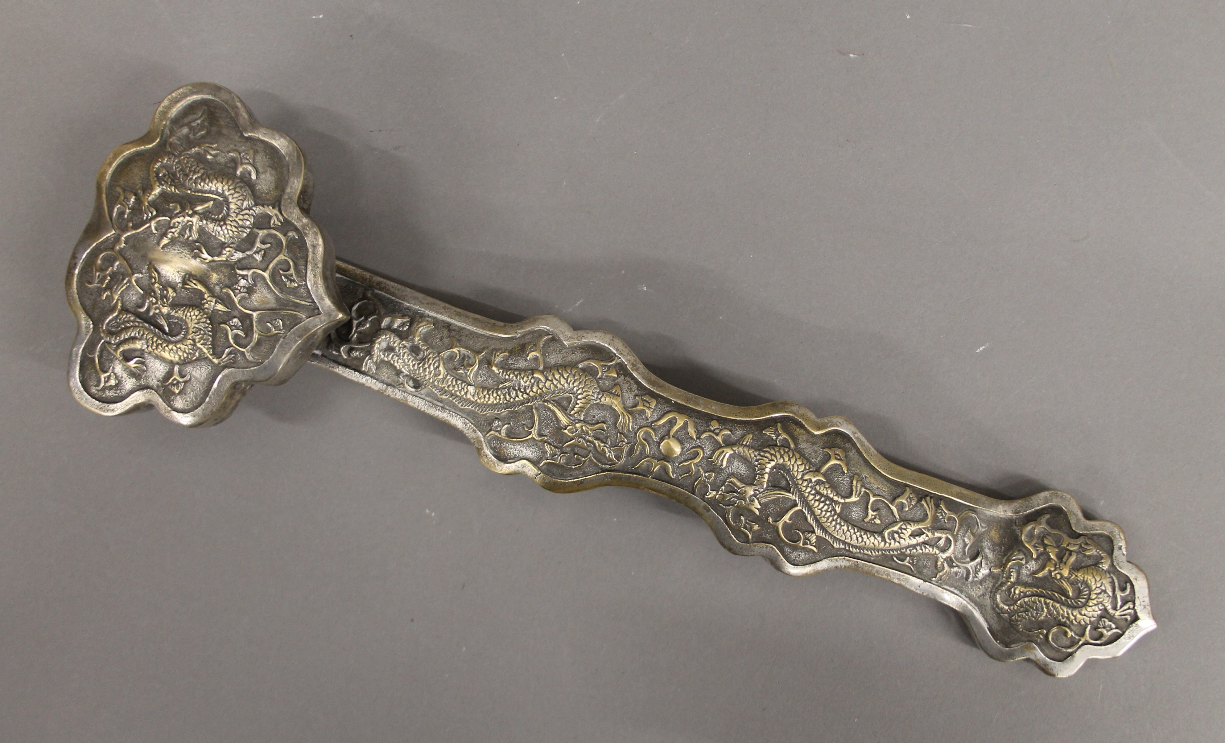 A Chinese silvered bronze ruyi sceptre. 35.5 cm long. - Image 3 of 4