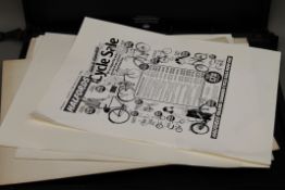 A large folio of various advertising proofs.