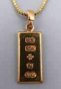 A 9 ct gold ingot on a 9 ct gold chain. Ingot 2 cm x 1 cm, chain 42 cm long. 6.4 grammes.