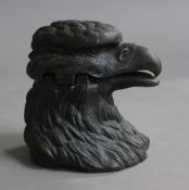 A bronze eagle form inkwell. 7 cm high.