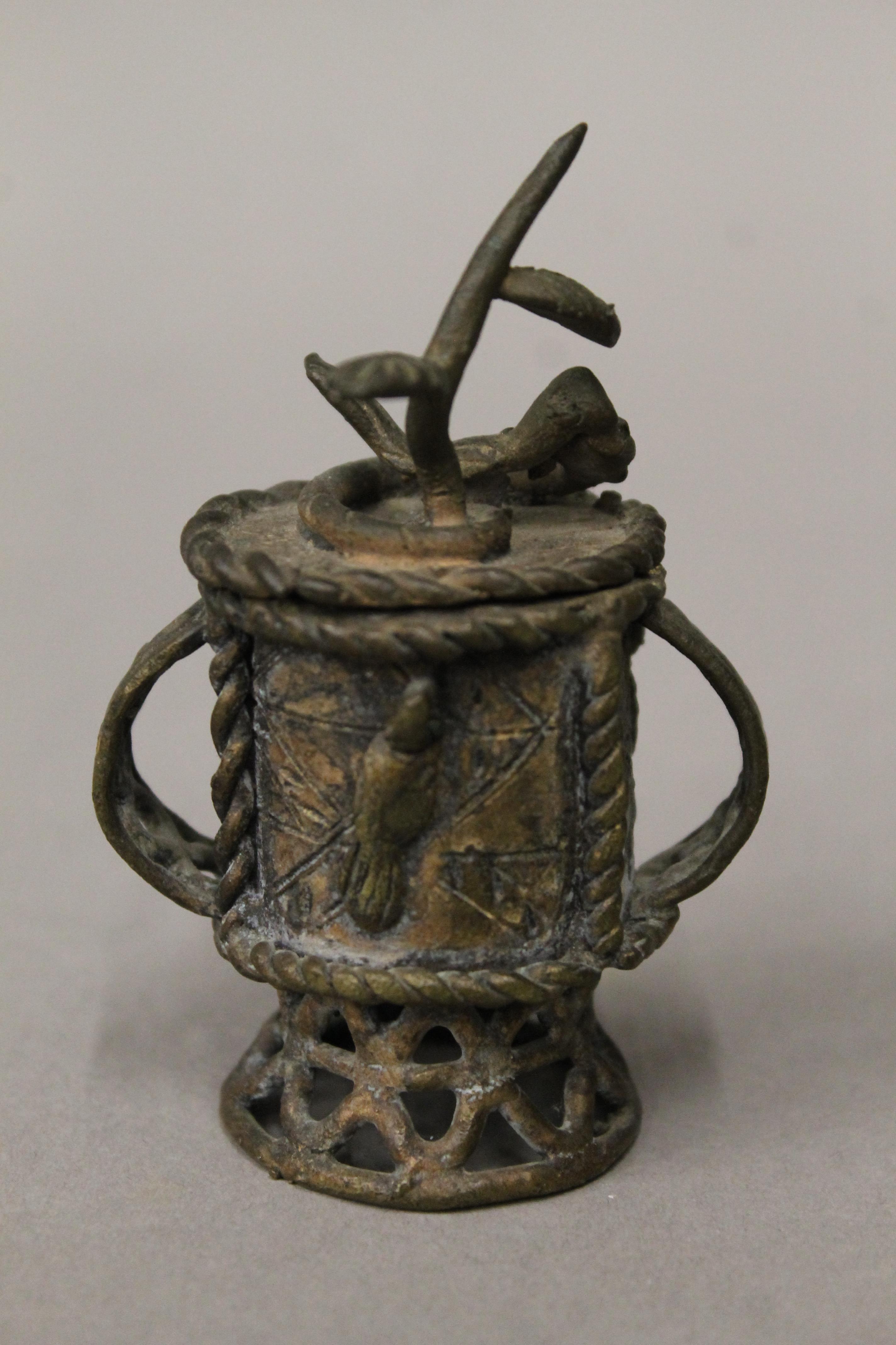A small Eastern patinated bronze lidded urn. 8.5 cm high. - Image 2 of 3