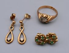 A 9 ct gold ring and two pairs of 9 ct gold earrings.