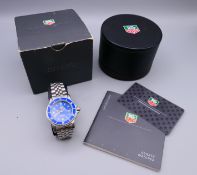 A Tag Heuer gentleman's wristwatch, with original box and papers. 4 cm wide.