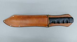A Sussex Armoury vintage bowie knife in scabbard. 41.5 cm long.