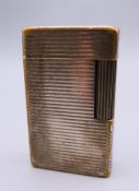 A plated Dupont lighter. 5.75 x 3.5 cm.