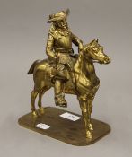 A bronze model of a cavalier on horseback. 21 cm high.