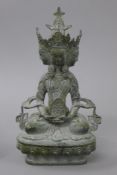 A bronze multi-faced model of Buddha. 21 cm high.