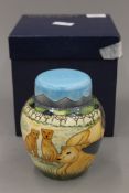 A boxed Moorcroft Pride of Lions ginger jar, numbered 219/250. 14.5 cm high.