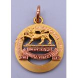 A 9 ct gold Martin Challenge Cup Southern Rhodesia Volunteers medallion. 2.5 cm diameter. 6.