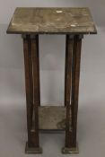 An Arts and Crafts plant stand. 90.5 cm high.