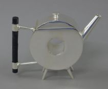 A Christopher Dresser style teapot. 13.5 cm high.