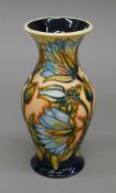 A Moorcroft Samarkand Lily vase. 19 cm high.