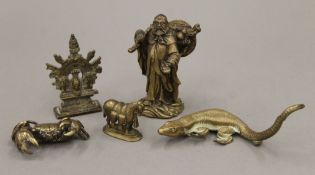 An Oriental bronze model of a sage and four others small bronze models. The former 9 cm high.