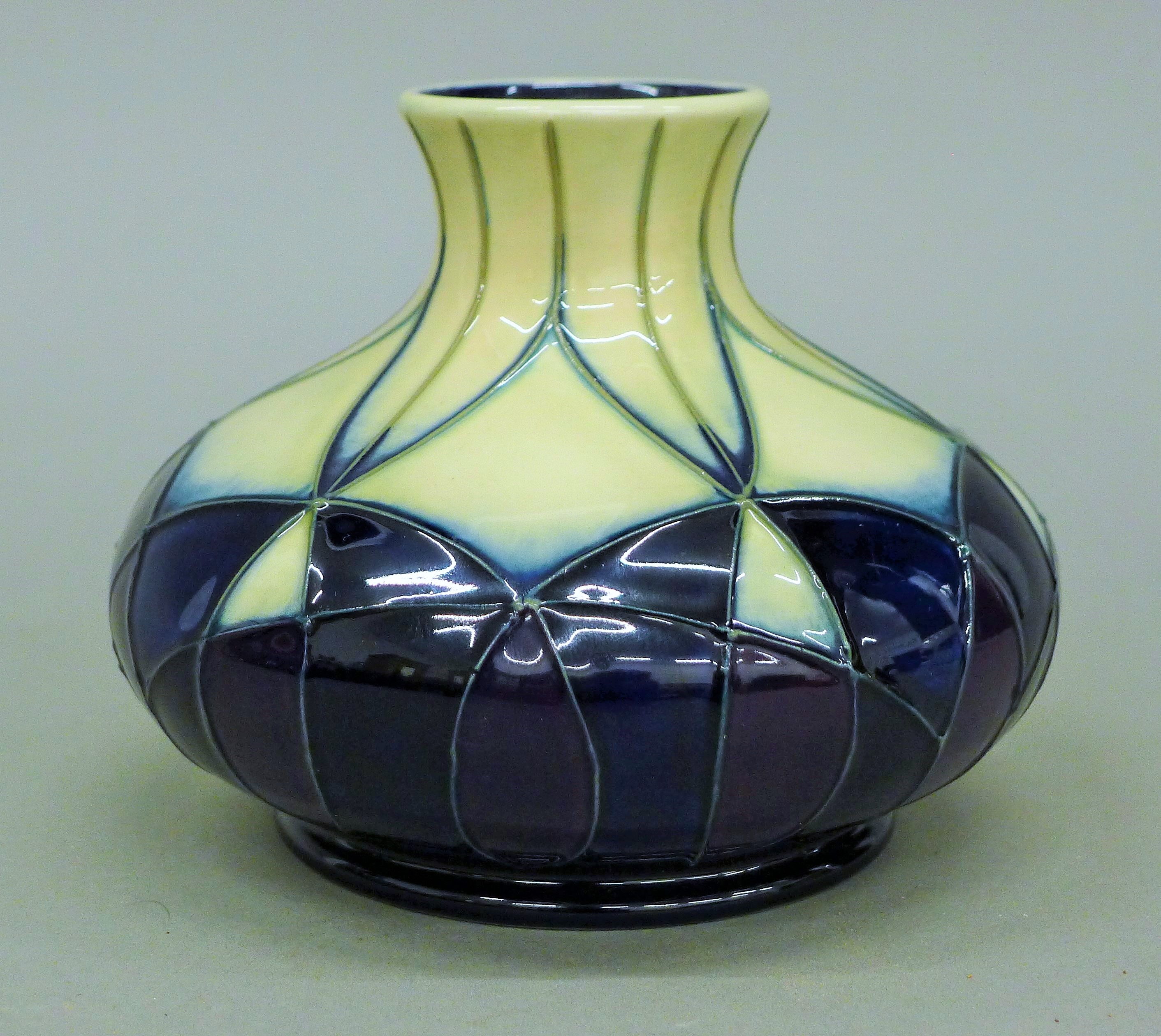 A Moorcroft Indigo vase. 9.5 cm high. - Image 2 of 3