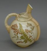 A Royal Worcester blush ivory ewer. 21 cm high.