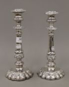 A pair of silver plate candlesticks. 24 cm high.