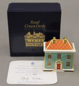 A boxed Royal Crown Derby Georgian Dolls House paperweight.