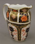 A Royal Crown Derby jug. 16 cm high.