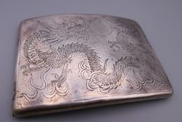 A Chinese silver cigarette case engraved with dragons. 11.5 cm x 8 cm. 123.3 grammes.