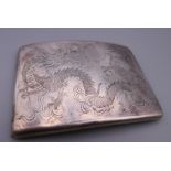 A Chinese silver cigarette case engraved with dragons. 11.5 cm x 8 cm. 123.3 grammes.