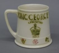 A James Macintyre & Co Ltd 1911 Coronation mug, signed by William Moorcroft,