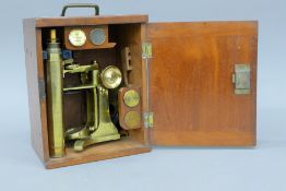 A cased Victorian monocular microscope. The case 24 cm high.