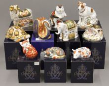 Ten boxed Royal Crown Derby paperweights.