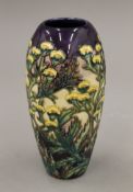 A Moorcroft Tamsey vase. 18 cm high.