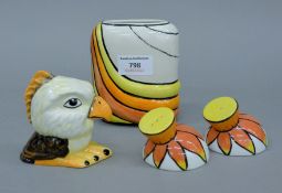 A Lorna Bailey purse vase, a cruet set and a bald eagle. The former 11 cm high.